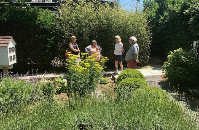 Four people in a garden